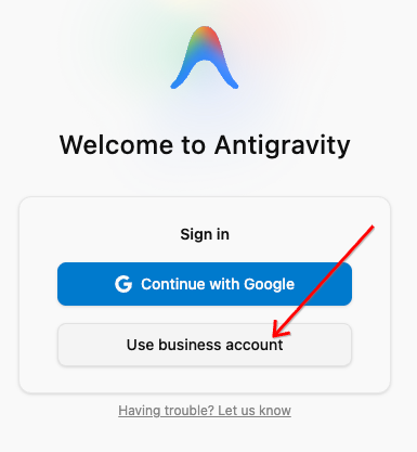 Welcome to Antigravity sign-in screen with arrow pointing to Use business account
